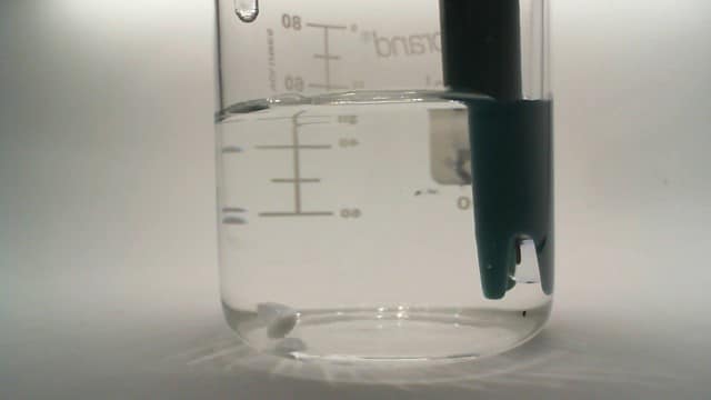 Colorimetric analysis based automated alarm to indicate chemical process completion